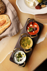 Set of dipping sauces hummus, guacamole, tomato tapenade