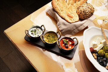 Set of dipping sauces hummus, guacamole, tomato tapenade