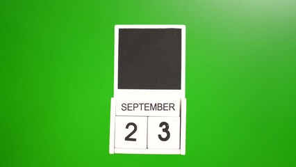 Calendar with the date September 23 on a green background. Illustration for an event of a certain date.