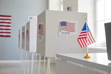 Foto op Plexiglas Empty polling station with row of white voting booths decorated with American flag at vote center. Presidential American elections in the United States. Democracy and election day concept. © Studio Romantic