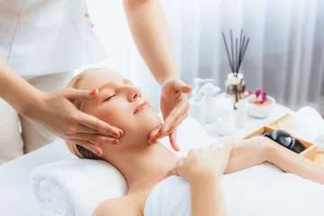 Poster Caucasian woman enjoying relaxing anti-stress head massage and pampering facial beauty skin recreation leisure in dayspa modern light ambient at luxury resort or hotel spa salon. Quiescent © Summit Art Creations