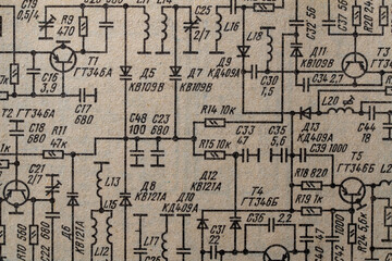 Old radio circuit printed on vintage paper electricity diagram as background. Electric radio scheme...