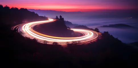  Photo of a highway at night. Neon night highway track with colorful lights and trails © Oksana
