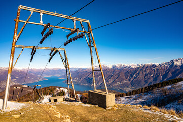 panorama on lake como, with the ski lifts closed, present on monte san primo., 