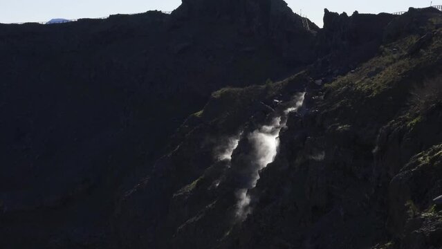 Mount Vesuvius volcano and caldera with gas vapor coming out of the brown earth in Naples, Italy