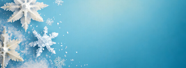 large white wintry snowflakes lie on a blue background