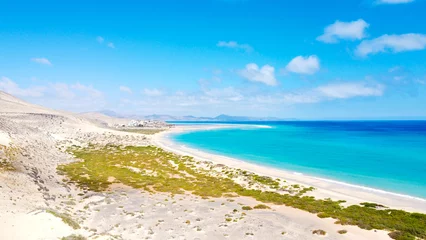 Foto op Plexiglas anti-reflex Sotavento Beach, Fuerteventura, Canarische Eilanden Aerial drone shot from Canary islands. Sotavento beach on the coast of Fuerteventura island. Natural sunny light. Blue sky and dunes. Coastline.