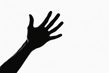Dark silhouette hand behind glass on white background