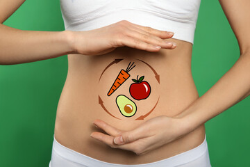 Healthy digestion. Woman showing circular arrows with illustration of different products on her...