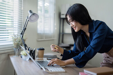 Woman on desk with laptop, credit card and ecommerce payment for online shopping at home. digital...