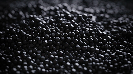 close up of a black surface, 3d black tiny plastic cylindrical grains , black plastic polymer pellets,polymer for pipes, Plastic and polymer industry, industry. Microplastic products.