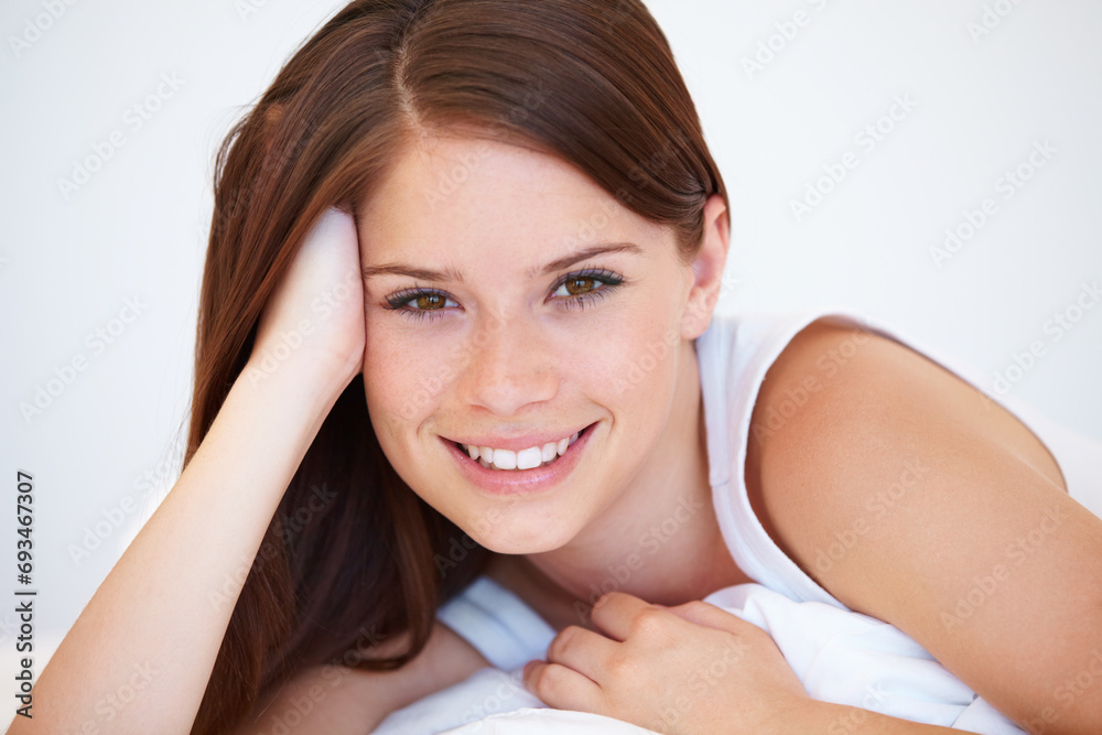 Canvas Prints Smile, beauty and portrait of woman on bed for relaxing with positive, good and confident attitude. Happy, calm and young female person from Canada laying and resting in bedroom of modern apartment.