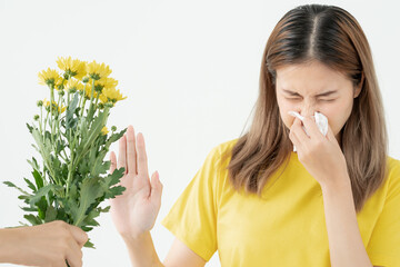 Pollen Allergies, asian young woman sneezing in a handkerchief or blowing in a wipe, allergic to...