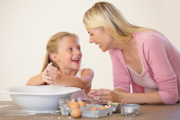 Eggs, baking and happy family bonding, love and excited mother and daughter prepare recipe, wheat flour or ingredients. Kitchen bowl, mama and youth kid girl learning home cooking together with mom