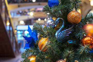 Glass swan figurine on Christmas tree. New Year concept.