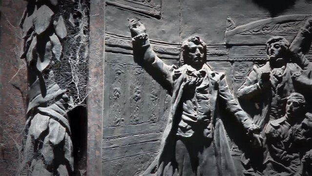 Metal Bas-relief depicting Historical Figures at the Statue of the Argentine Politician Called "Rodriguez Peña" in Buenos Aires, Argentina. Close Up.  
