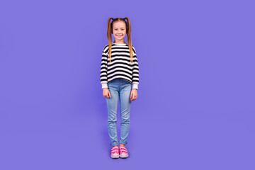 Full length photo of cute good mood little child dressed striped pullover smiling isolated purple...