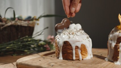 A woman sprinkles dried lavender on the Easter cake to add a festive aroma.