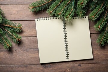 notepad with fir tree branches table
