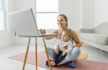 Sport Activities With Baby. Young Mom Exercising With Her Infant Son At Home
