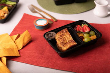 Peanut butter and jelly sandwich with fresh fruit