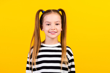 Photo of cute sweet little child dressed striped pullover smiling empty space isolated yellow color background