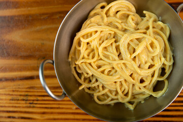 Creamy noodles and a small bowl