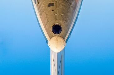 fragment of the plane of an old airliner against a blue sky