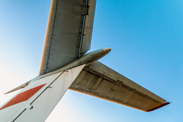 wings of a large soviet airliner against a blue sky
