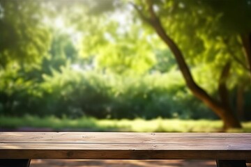 Rustic wooden table in nature. Blank board for summer and spring creations surrounded by greenery and bathed in sunlight