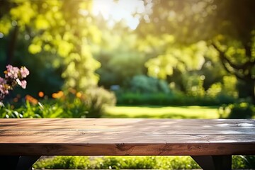 Fototapeta premium Rustic wooden table in nature. Blank board for summer and spring creations surrounded by greenery and bathed in sunlight