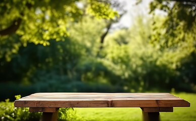 Naklejka premium Rustic wooden table in nature. Blank board for summer and spring creations surrounded by greenery and bathed in sunlight