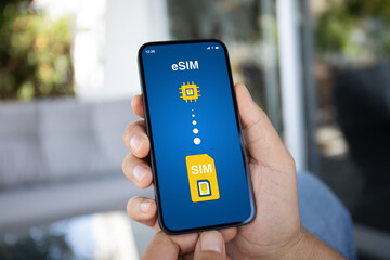 Man hand hold phone with Sim card replacement on eSim