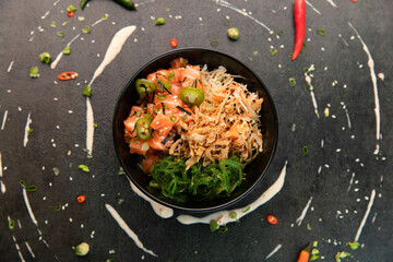 Raw salmon, Poké bowl with Wakame salad