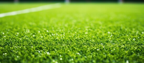 Close-up shot of the penalty area on a vacant artificial turf soccer field.