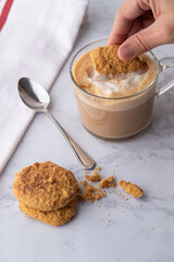 Dippin cookie in to coffee