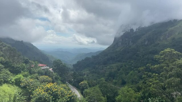 Establishing Handheld Shot Looking Down Ella Gap on Cloudy Morning in Sri Lanka