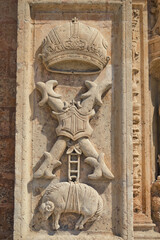 Religious sculptures at outer wall of catholic church.