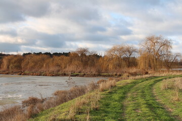 A river with grass and trees around it