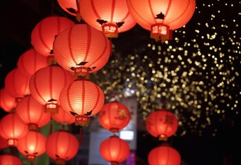 Chinese new year concept. Red lanterns are hanging in China Town on a blurry, bokeh background. Copy space for text, advertising, message, logo