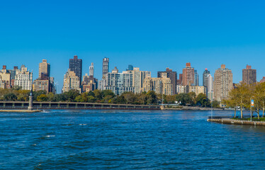 Fototapeta na wymiar Panoramic view of buildings in central Manhattan New York seen from the East River