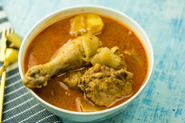 Thai chicken massaman curry or kaeng massaman gai in Thai, served in the white bowl