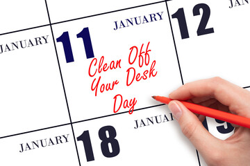 January 11. Hand writing text Clean Off Your Desk Day on calendar date. Save the date.