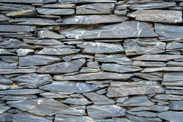 Background from an old natural slate stone wall