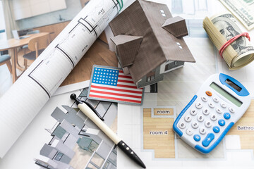 Architectural plan, laptop, dividers ,pencil ,pen ,ruler, glasses and smartphone and blueprint on wooden table. Side View