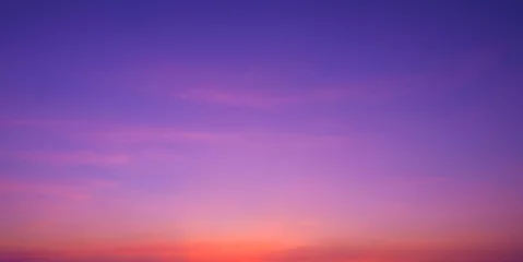 Poster Colorful romantic twilight sky with beautiful pink sunset cloud and orange sunlight on dark blue sky after sundown in evening time, idyllic peaceful nature panoramic background © Prapat