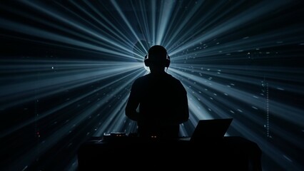 Silhouette of a DJ at Club Event with Stage Lights