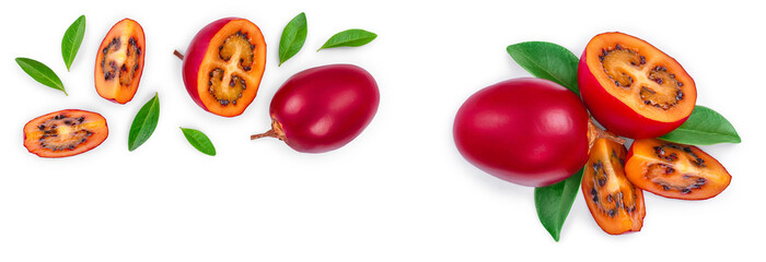 Fresh tamarillo fruit with leaves isolated on white background with copy space for your text. Top view. Flat lay