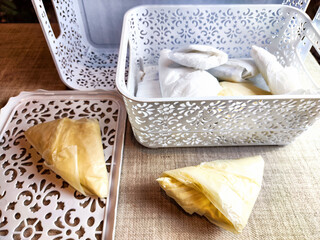 Plastic bag folded into a triangle for storage. Ways of storing and laying at home