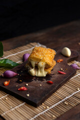 risoles filled with chicken mozzarella, indonesian food, coating with bread crumb, decorated with condiment and garnish.